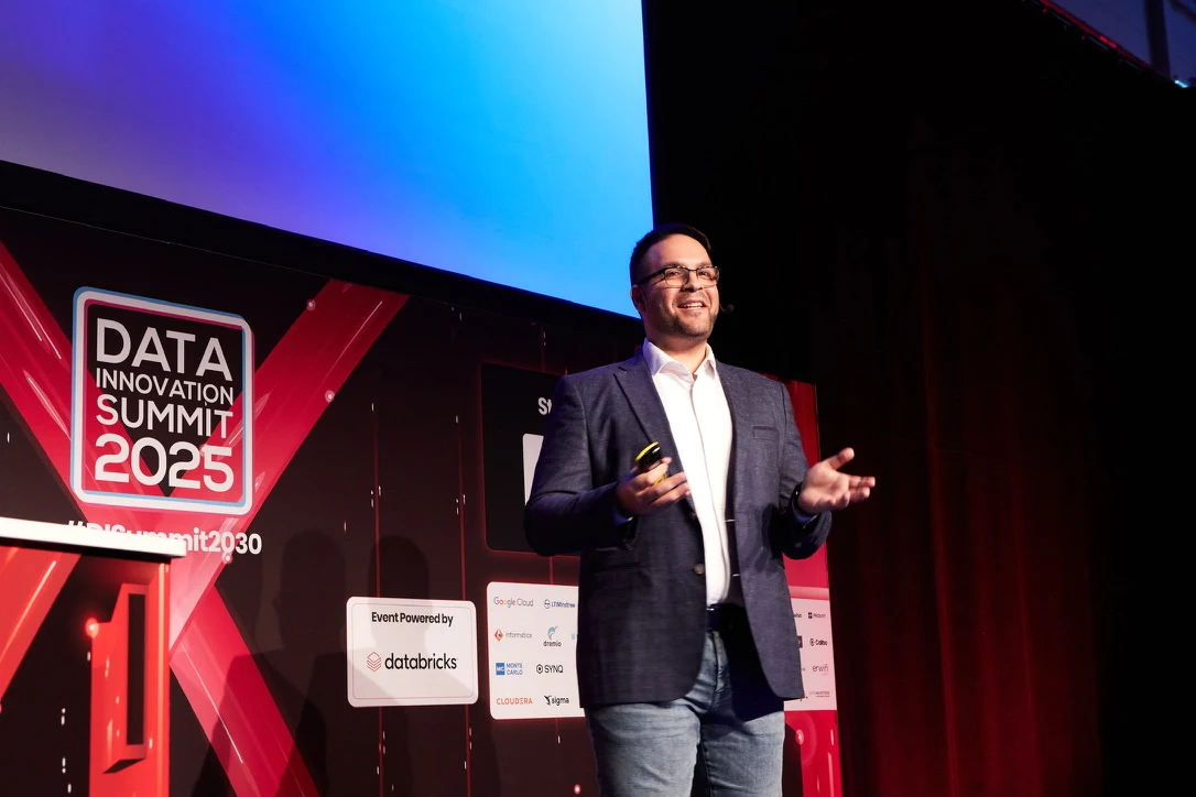 Ilko speaking on stage at Data Innovation Summit 2025 in Stockholm
